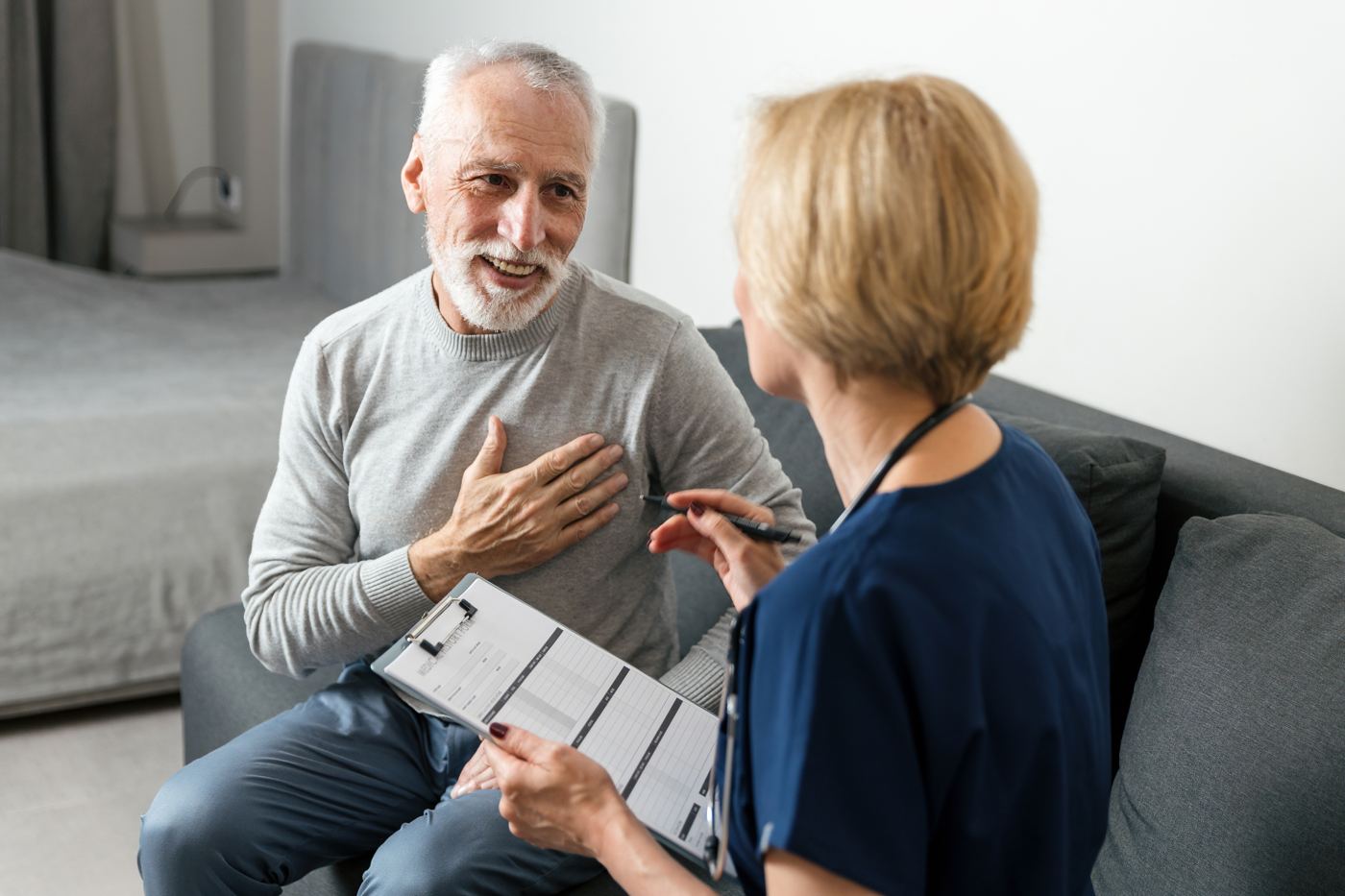 Doctor talking through results with an older male patient