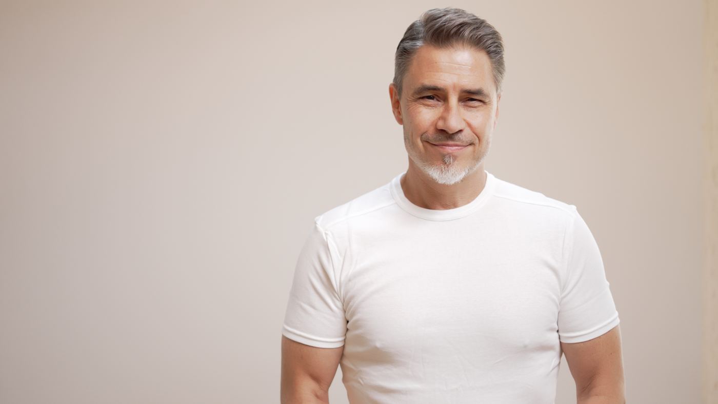 Smiling middle-aged man in a white T-shirt